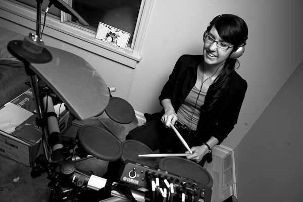 Laura learned how to play a beat on Mike's new electronic kit.