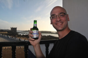 Chris enjoying Morocco's special brew of beer.
