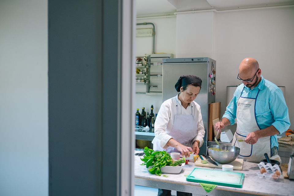 Marcella, the Chef and owner of the Giglio Cooking School works with Chris to make the "sformato di zucchini passati" (zucchini pastry) or as referred to by Marcella, "the green children". 